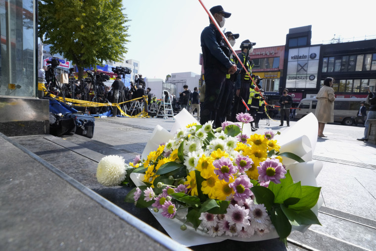 Flowers left near the scene of a deadly accident in Seoul, South Korea, Sunday, Oct. 30, 2022. 