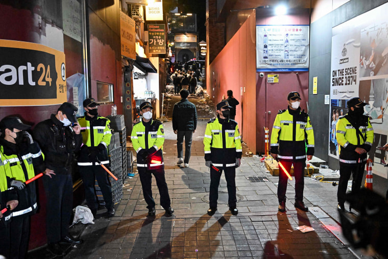 Police stand guard at the scene of a Halloween crush in the Itaewon district in Seoul, South Korea, on Oct. 30, 2022.