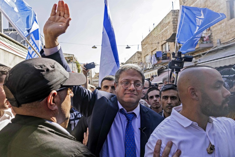 Israeli far-right lawmaker and Jewish Power party leader Itamar Ben-Gvir greets supporters during a campaign rally in Jerusalem's Mahane Yehuda Market on Oct. 28, 2022.