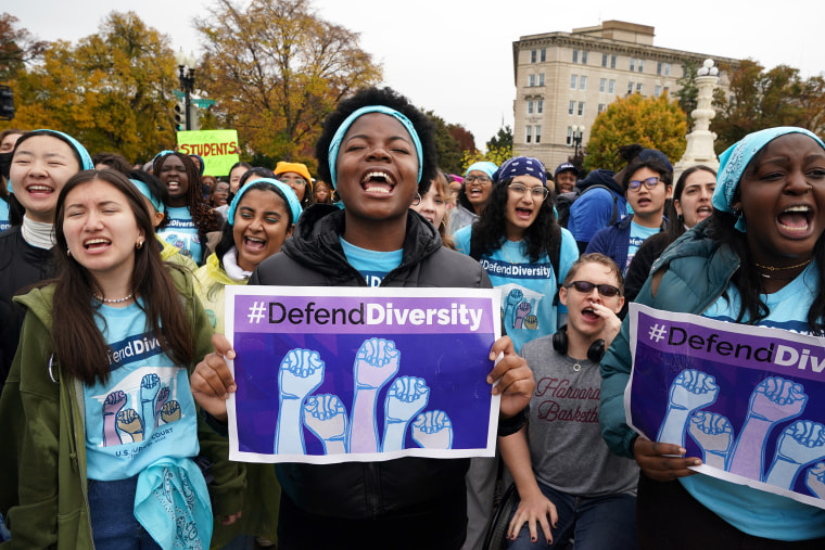 Activists rally outside the Supreme Court on Oct. 31, 2022, as the justices hear oral arguments in the affirmative action cases involving Harvard and the University of North Carolina at Chapel Hill. 