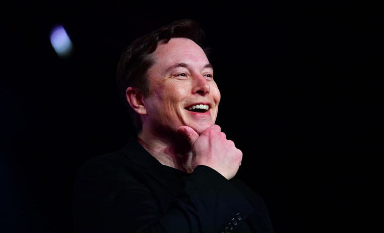 Elon Musk smiling on stage at an event in California to launch a new Tesla model in March, 2019. 