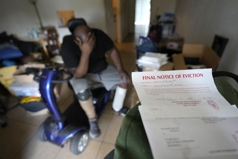 Freddie Davis waits for a friend to arrive to help him move his remaining belongings to a storage unit, after receiving a final eviction notice at his one-bedroom apartment, on Sept. 29, 2021, in Miami. 