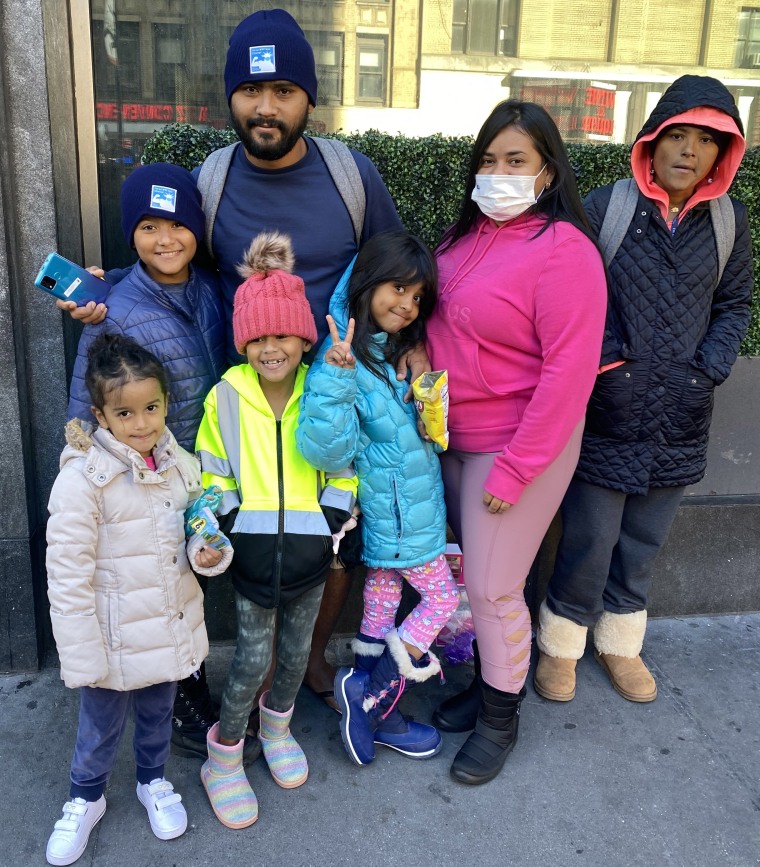 Jan Rojas, back second left, a migrant from Venezuela, with his family in New York City.