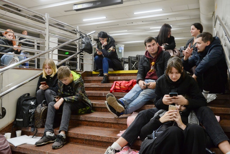 Explosions reported in several Ukraine regions as people take shelter in the metro station on Monday. 