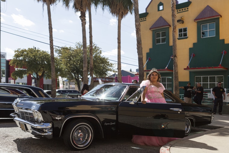 Young girls wearing their quinceañera dresses led their friends and families in a parade through the streets of San Antonio.