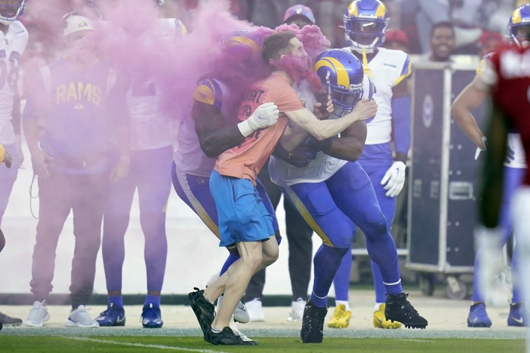 Super Bowl was disrupted by two fans running onto the field and getting  tackled