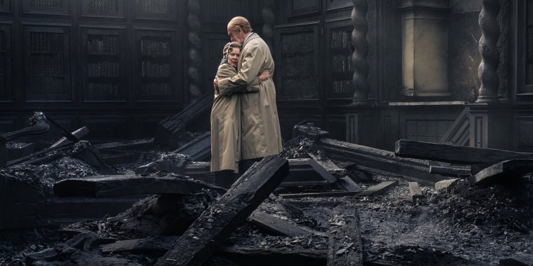 The queen and Prince Philip hold each other after the fire at Windsor Castle.