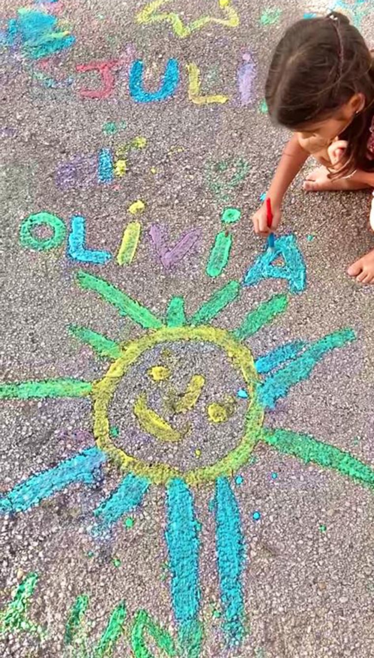 child drawing with chalk paint