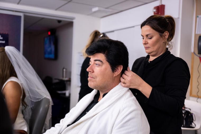 Carson Daly trying on his wig as David Copperfield.