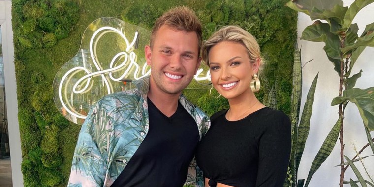 Chase Chrisley and Emmy Medders pose for a picture together.