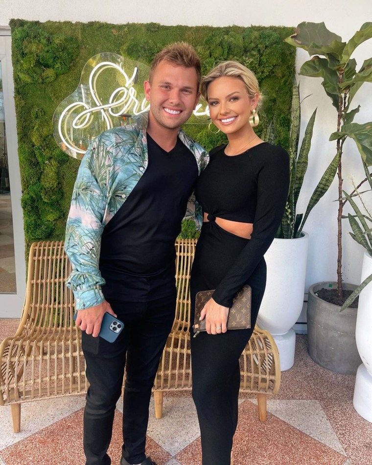 Chase Chrisley and Emmy Medders pose for a picture together.