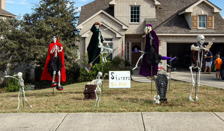 Skeleton Halloween decorations in a Texas front yard