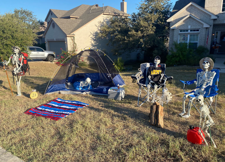 Steven and Danielle Dinote of Texas staged a skeleton-themed camping scene on their front lawn.