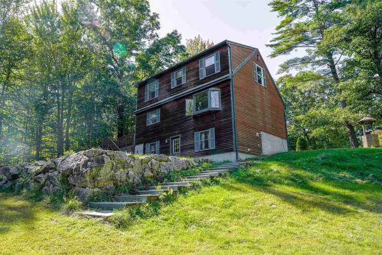 One image of the home from afar shows just a glimpse of Myers, with his head and partial body visible in a window.
