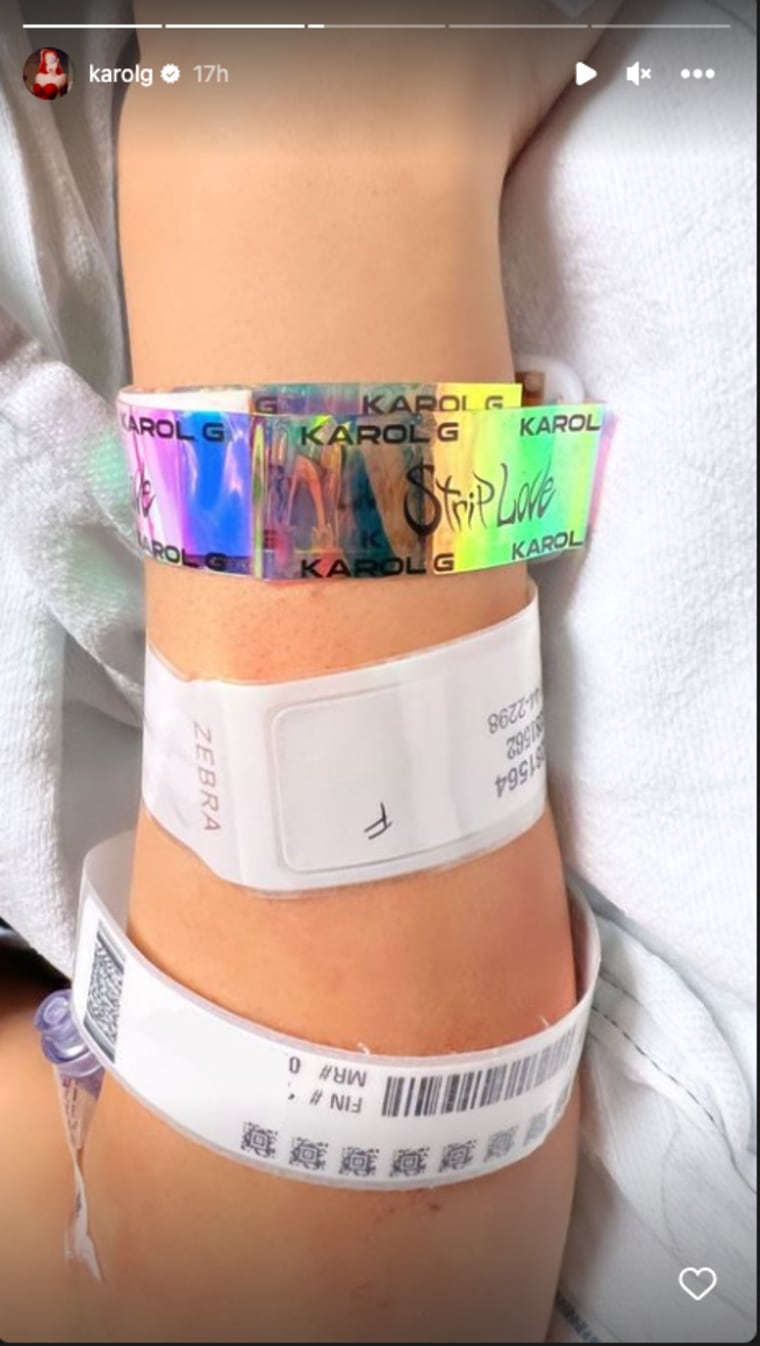 The new mom with her hospital and Karol G concert bracelet. 