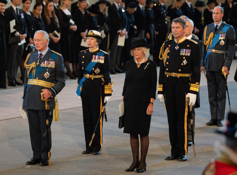 King Charles III, Princess Anne, Camilla, Queen Consort, Vice Admiral Sir Timothy Laurence pay their respects in the Palace of Westminster during the procession for the Lying-in State of Queen Elizabeth II on Sep. 14, 2022 in London, England.