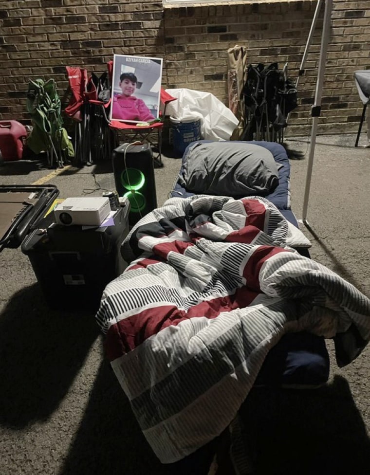 Brett Cross camped out for more than 10 days outside the school district building.