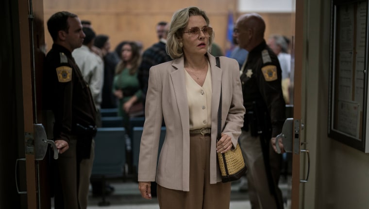 Penelope Ann Miller as Joyce Dahmer walks out of the court room where Jeffrey Dahmer was found guilty.