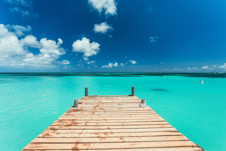 Pier Over the clear blue sea Against Blue Sky