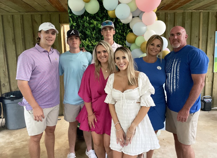 Sherry Head (2nd from the right, in blue) with family.