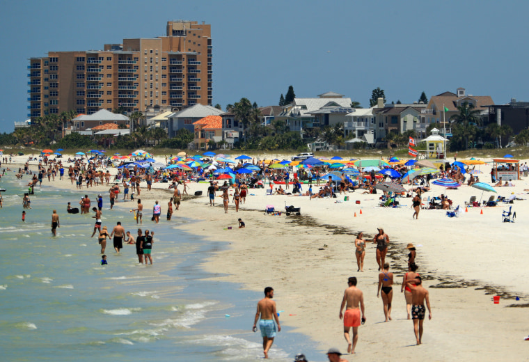 Visitors at Clearwater Beach after Gov. Ron DeSantis opened the beaches on May 4, 2020 in Clearwater, Fla.