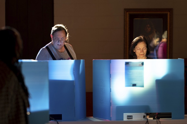 Voters mark their ballots at Lawrenceville Road United Methodist Church in Tucker, Ga., on Nov. 8, 2022.