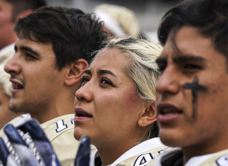 Image: Pumas' kicker Andrea Martinez sings her team's anthem before a Liga Mayor football match against Aztecas in Mexico City on Oct. 8, 2022.