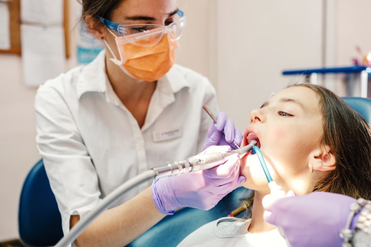 Girl receiving dental care