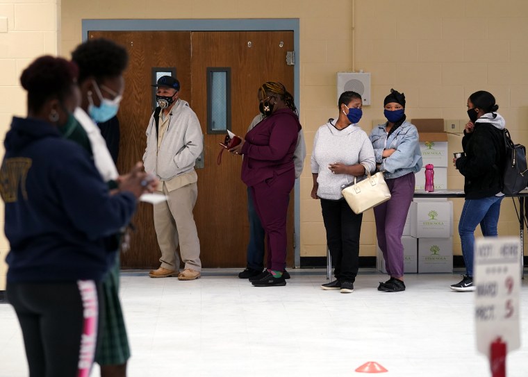 People line up to vote in New Orleans on Nov. 3, 2020.