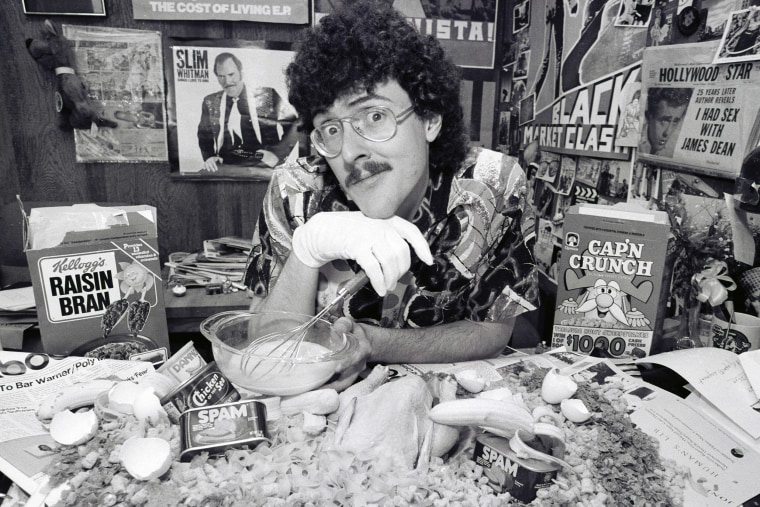 Weird Al Yankovic as he poses with various food items during a photo shoot, March 20,1984 in Los Angeles.