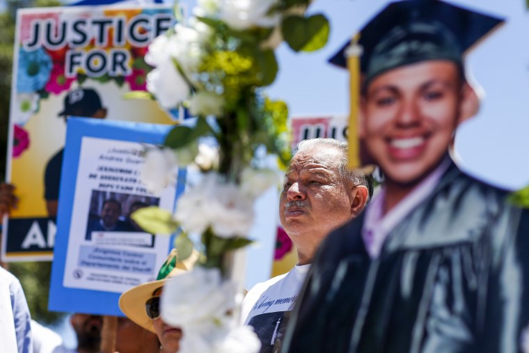 Cristobal Guardado, center, joins dozens of demonstrators near the Compton Sheriff Station on June 19, 2022, in Compton, Calif., to demand the prosecution of law enforcement personnel who shot and killed his son, Andres.