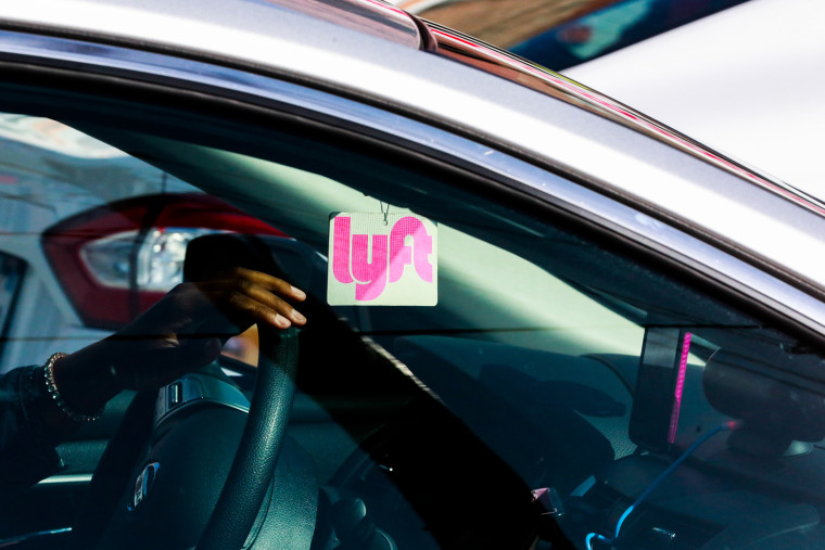 A Lyft decal is seen through the window of a car in San Francisco.