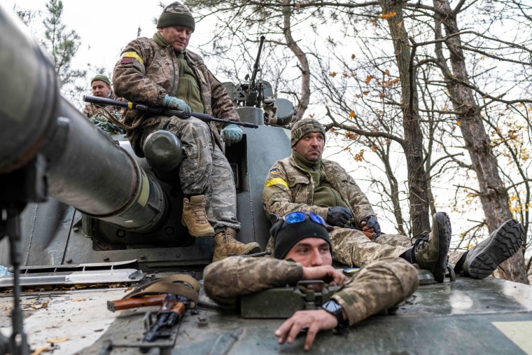 Ukrainian artillery unit members get prepared to fire towards Kherson on Oct. 28, 2022.