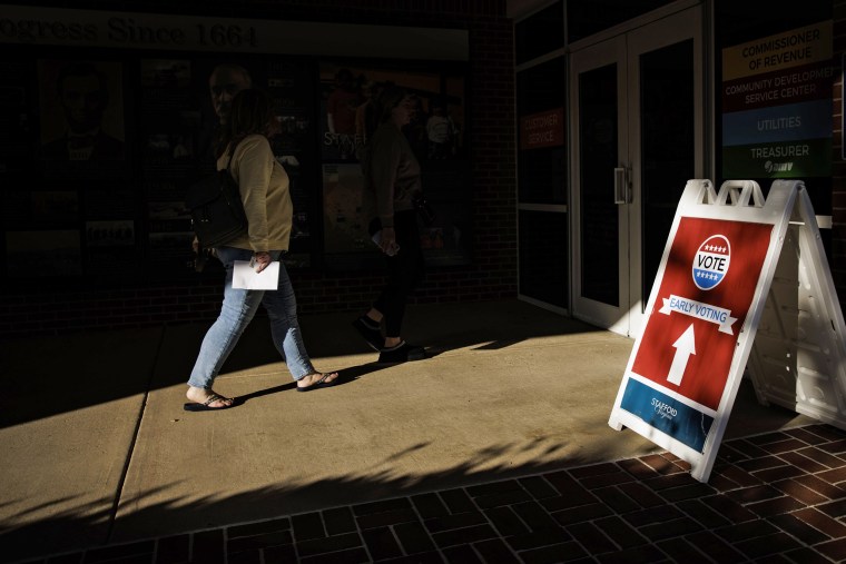 A voter enters an early voting location on Nov. 3, 2022 in Stafford, Va.