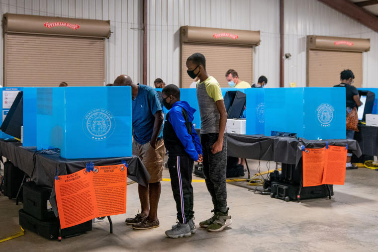 Voters cast their ballots at an early voting location at the Gwinnett County Fairgrounds  in Lawrenceville, Ga., on Oct. 24, 2020.