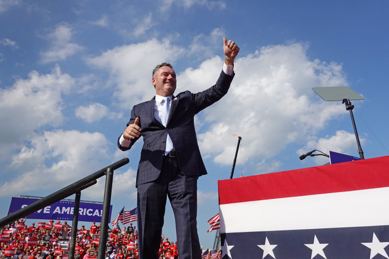 Republican gubernatorial candidate Tim Michels waves during a rally hosted by former President Donald Trump in Waukesha, Wisc, on Aug. 5, 2022. 