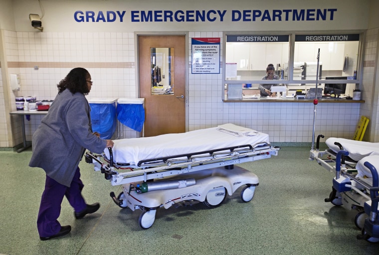 A worker wheels beds through the emergency department at Grady Memorial Hospital, in Atlanta on Jan. 24, 2014.