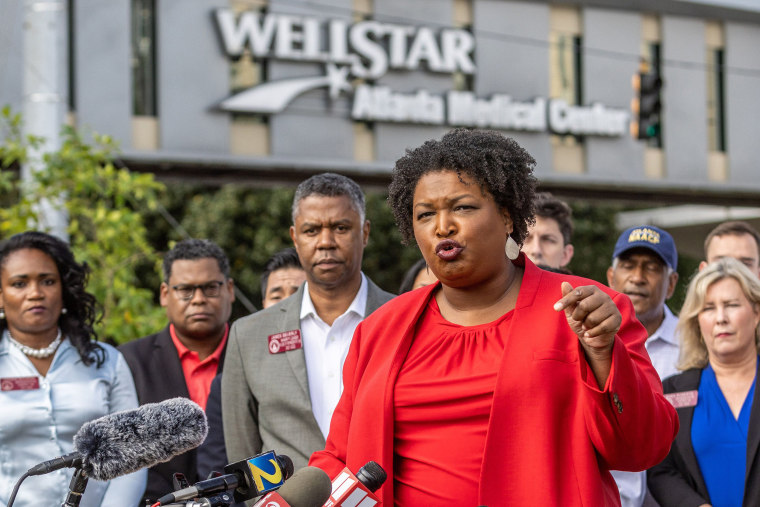 Stacey Abrams at a news conference alongside health care providers outside the WellStar Atlanta Medical Center on Sept. 2, 2022.