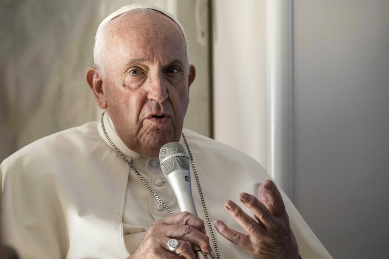 Pope Francis speaks onboard the papal plane on Nov. 6, 2022.