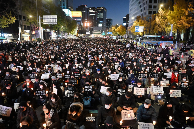 People take part in a candlelight vigil to commemorate the 156 people killed in the October 29 Halloween crowd crush in Seoul, South Korea, on Nov. 5, 2022.