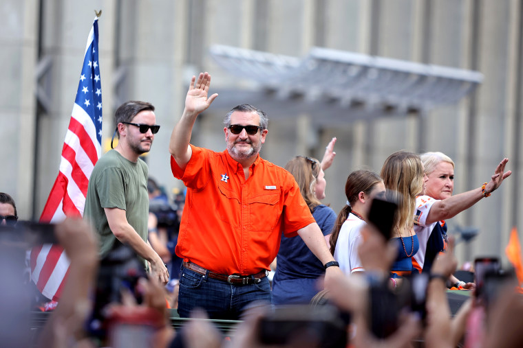 Nov 7, 2022; Houston, Texas, USA; State senator Ted Cruz (orange) waves to the crowd during the Houston Astros Championship Parade in Houston, TX.