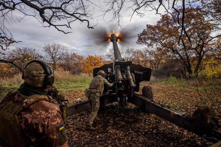 Ukrainian artillerymen fire a howitzer on the front line near the town of Bakhmut, in eastern Ukraine's Donetsk region, on Oct. 31, 2022. 