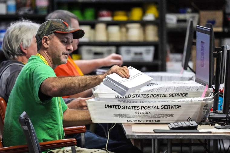 Image: Allegheny County workers scan mail-in and absentee ballots at the Allegheny County Election Division Elections warehouse in Pittsburgh on Nov. 3, 2022.