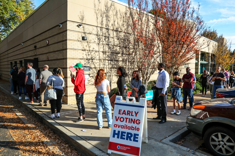 Image: People wait in line for early voting for the midterm elections at Ponce De Leon Library on Nov. 4, 2022 in Atlanta.