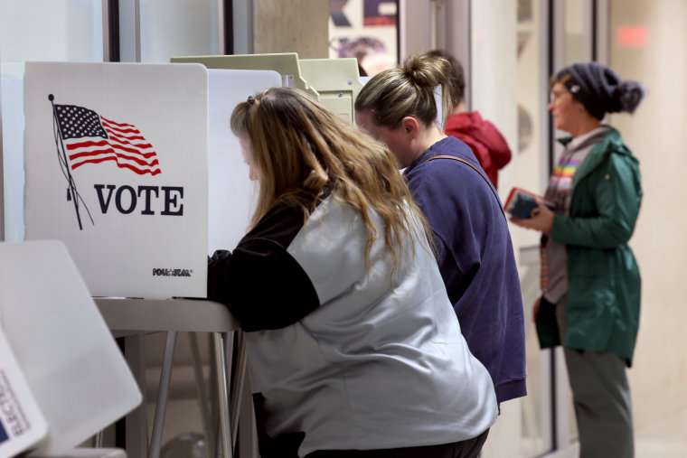 Residents cast their ballots during in-person absentee voting in Green Bay, Wis., on Nov. 4, 2022.