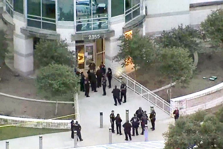 Law enforcement outside the Dallas County Medical Examiner’s Office on Tuesday afternoon.