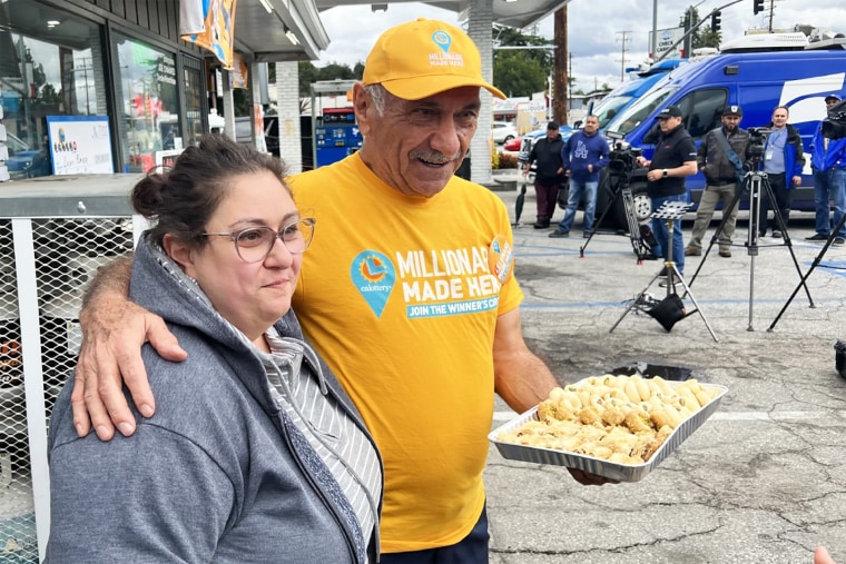 Joseph Chahayed, owner of the gas station, and his daughter Sandra Chahayed, hand out baklava.