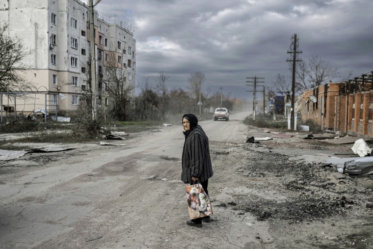 Image: An old woman walks in the Kherson region village of Arkhanhelske on November 3, 2022, which was formerly occupied by Russian forces. 