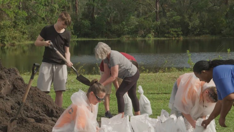 Residents prepare sandbags ahead of a possible hurricane in Volusia County, Fla.