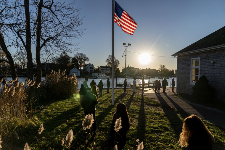 Voters line up to cast their ballots in the midterm election at the Aspray Boat House in Warwick, R.I., on Tuesday. 
